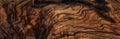 Texture of dark brown olive wood plank. background of wooden surface