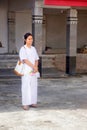 Thai students wear white clothes making a merit at the temple in Pranburi, Thailand July 21,2017