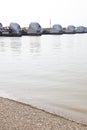 Portrait of Thames Barrier by pebble beach