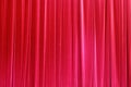 Photo Theatrical curtain of scarlet color of velvet.