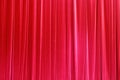 Photo Theatrical curtain of scarlet color of velvet.