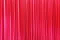 Photo Theatrical curtain of scarlet color of velvet.