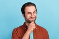 Photo of thinking beard millennial guy hand face wear eyewear outfit isolated on blue color background