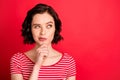 Photo of thoughtful lady thinking over her plan about running away from home while isolated with red background