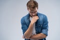 Young handsome minded man trying to find way to solve problem Royalty Free Stock Photo