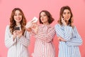 Photo of three gorgeous young girls 20s wearing colorful striped