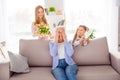 Photo of three peaceful idyllic woman give congratulate bunch flowers postcard home indoors