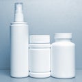 photo of three plastic cans for package pills and vitamins Royalty Free Stock Photo