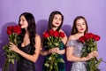 Photo of three romantic dreamy ladies hold bunch roses close eyes wear fancy dresses isolated purple color background