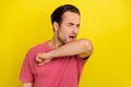 Photo of tired exhausted student feel asleep yawn shoulder cover mouth wear pink t-shirt isolated yellow color