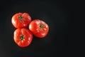 Photo of tomatoes on a black Royalty Free Stock Photo