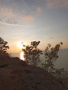photo from the top of the mountain and the view of the sun setting in the afternoon Royalty Free Stock Photo