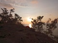 photo from the top of the mountain and the view of the sun setting in the afternoon Royalty Free Stock Photo