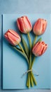 Photo Of Top View Tulip Flowers On Light Blue Blank Paper Background, , Mothers Day Concept, Feminine Concept. Generative AI