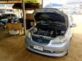 2007 Toyota vios openning its trunk show its broken engine waiting for mechanic to fix it in local garage in Paknampran, Thailand