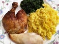 Roast Chicken With Spinach and Yellow Rice Royalty Free Stock Photo