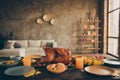 Photo of traditional thanksgiving dinner meal with roasted turkey corn harvest cranberry pie tomato potato plates forks