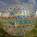 Photo transparent ball-Jogging - Zorba with multi-colored radial lines on the background of blue sky. Royalty Free Stock Photo