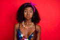 Photo of tricky childish wavy dark skin lady wear pin up outfit bloated cheeks red color background