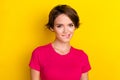 Photo of tricky cunning lady wear pink t-shirt smiling biting lip isolated yellow color background