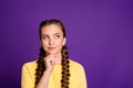 Photo of tricky lady long braids hairdo hold arm on chin looking interested empty space have crazy idea wear casual