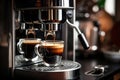 Photo of two cups being filled with steamy hot coffee