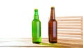 Photo of two different full beer bottles with no labels. Separate clipping path for each bottle included.2 two separate photos