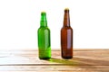 Photo of two different full beer bottles with no labels. Separate clipping path for each bottle included.2 two separate photos Royalty Free Stock Photo