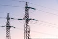 Two electricity pylons at dusk Royalty Free Stock Photo