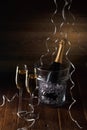 Photo of two glasses, bucket of ice and bottle of wine Royalty Free Stock Photo