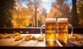 Photo of Two Glasses of Frothy Beer on a Rustic Wooden Table