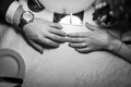 Photo of two hands: wife and husband. Girl`s finger with ring with diamond.