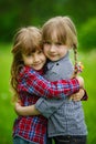 Photo of two happy hugging girls