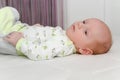 Two months old newborn male baby enjoying