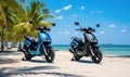 Photo of two motor scooters parked on a beach near the ocean