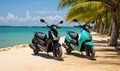 Photo of two motor scooters parked on a beach with palm trees