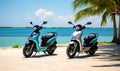 Photo of two motor scooters parked on a sandy beach