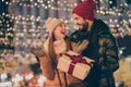 Photo of two people amazed girl get from loving husband dream gift box under evening x-mas outside illumination Royalty Free Stock Photo