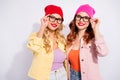 Photo of two pretty confident ladies wear specs casual clothes isolated white background Royalty Free Stock Photo