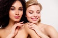 Photo of two pretty girls touch enjoy soft pure skin body isolated over pastel color background Royalty Free Stock Photo