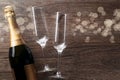 Photo of two wine glasses, bottle of champagne, light spots Royalty Free Stock Photo