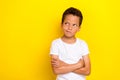 Photo of uncertain unsure boy arm folded decide consider question interested look empty space  on yellow color Royalty Free Stock Photo