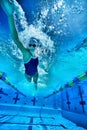 Underwater shot of woman swimming in pool Royalty Free Stock Photo
