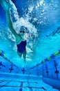 Underwater shot of woman swimming in pool