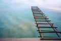 Photo of unfinished little bridge on the lake, abstract bridge to sky