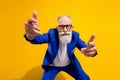 Photo of unhappy angry old man point you strict wear glasses blue suit isolated on shine yellow color background Royalty Free Stock Photo