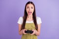 Photo of unhappy angry upset woman hold hands joystick scream game stressed isolated on violet color background