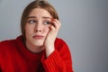 Photo of unhappy beautiful woman thinking and looking aside