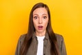 Photo of unhappy scared excited young amazed woman bad mood fake news isolated on yellow color background Royalty Free Stock Photo