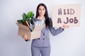 Photo of unhappy worker young dismissed lady financial crisis lost work hold carton box stuff fired quit hold placard
